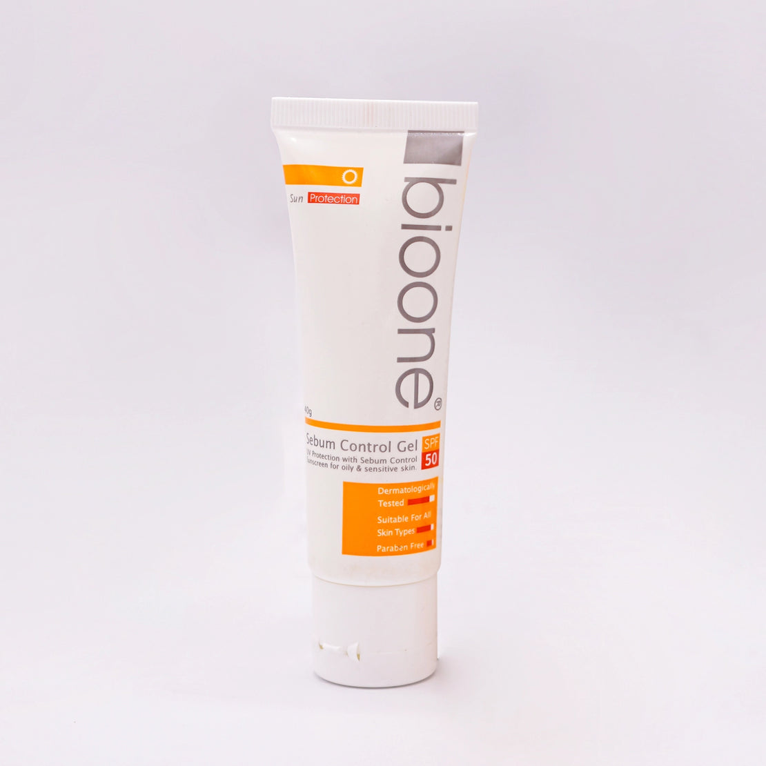 BioOne Sebum Control Gel SPF 50, a 50g white tube with an orange, white, and black label, featuring a sun icon.