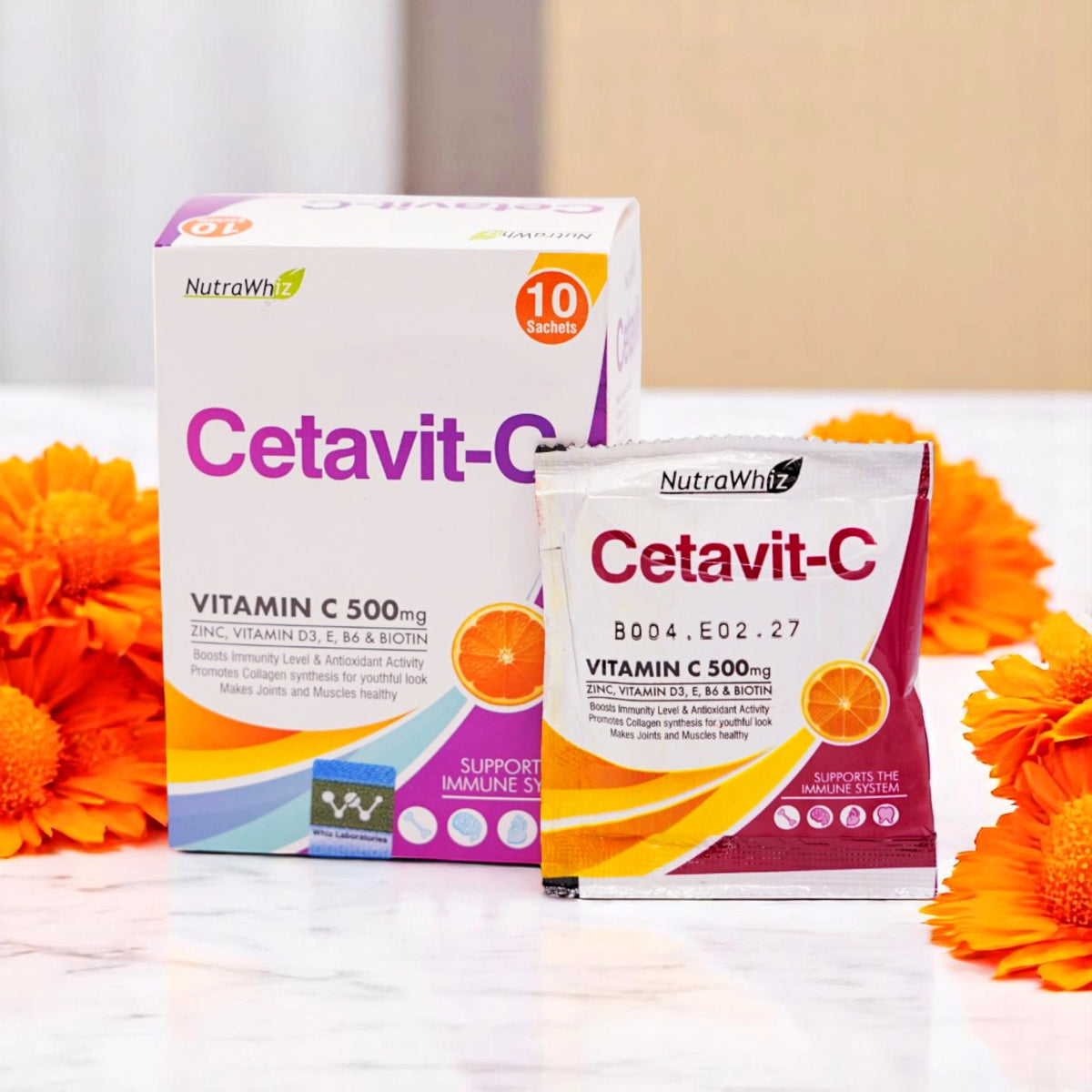 NutraWhiz Cetavit-C Vitamin C 500mg, 10 sachets, in a white box with purple, orange, and yellow accents and a single sachet.