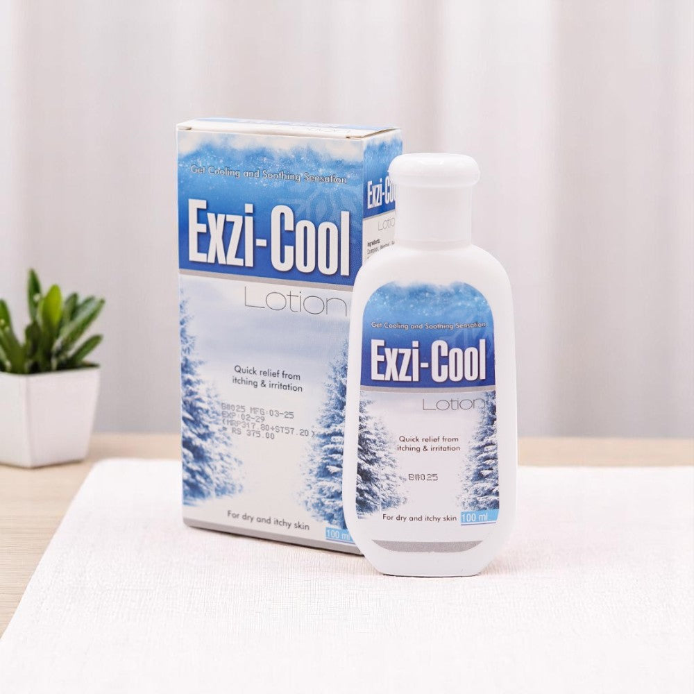 Exzi-Cool Lotion, 100ml white bottle with a blue winter scene label and a white cap, and its matching white and blue box, set on a white surface with a small green plant in the background.