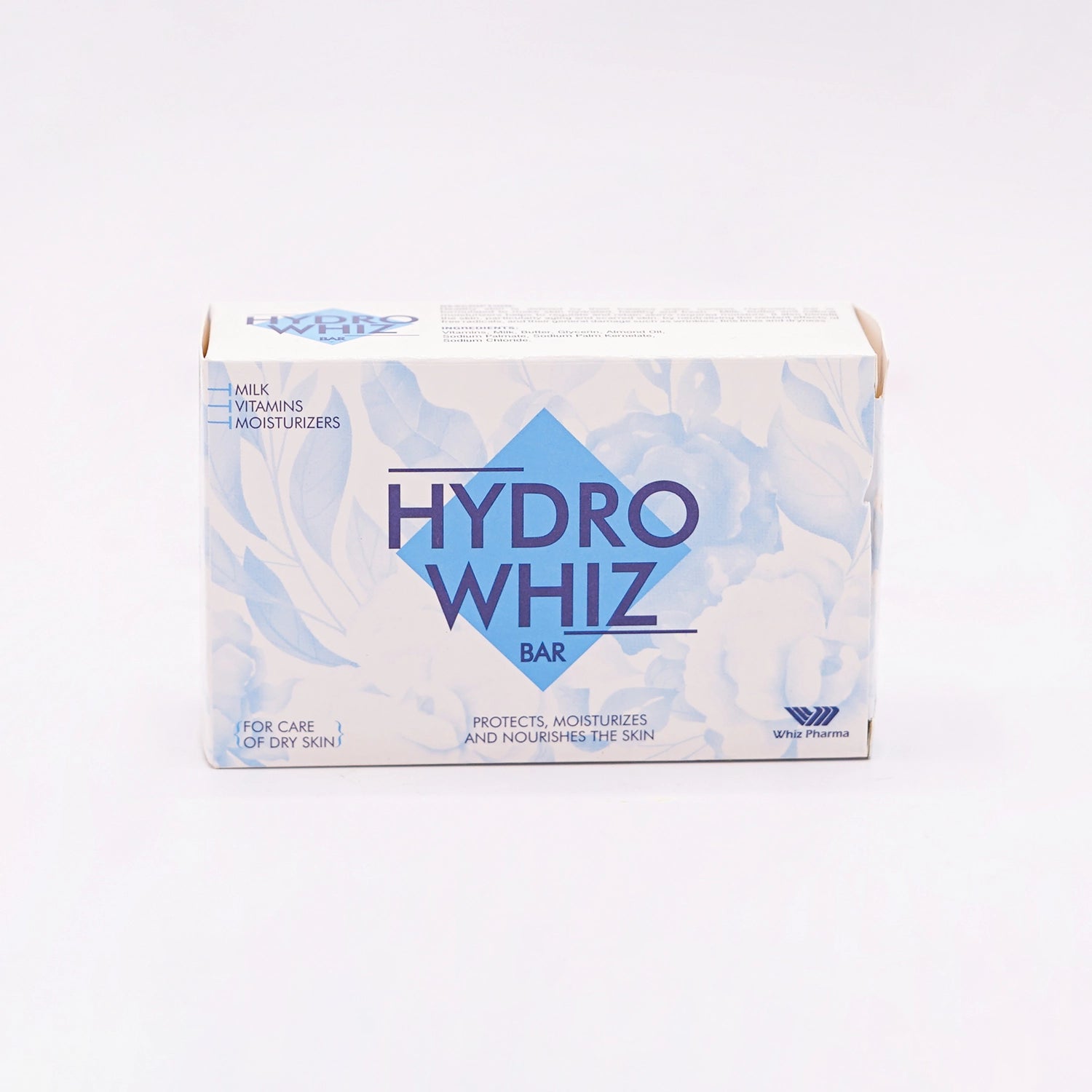 HydroWhiz Bar, containing Milk, Vitamins, and Moisturizers, for the care of dry skin, in a white box with a blue diamond design and floral pattern.