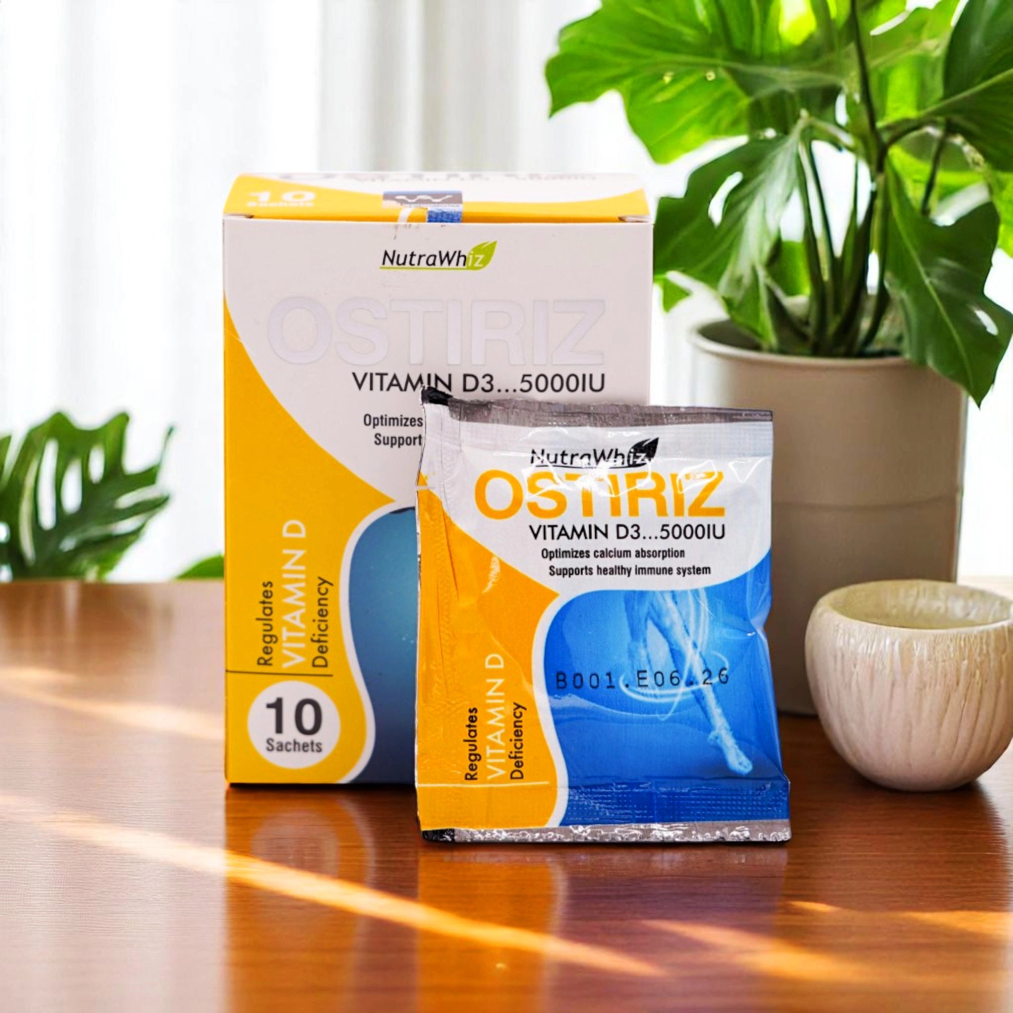 NutraWhiz Ostiriz Vitamin D3 5000 IU sachets, in a white box with yellow, blue, and orange accents and a single sachet