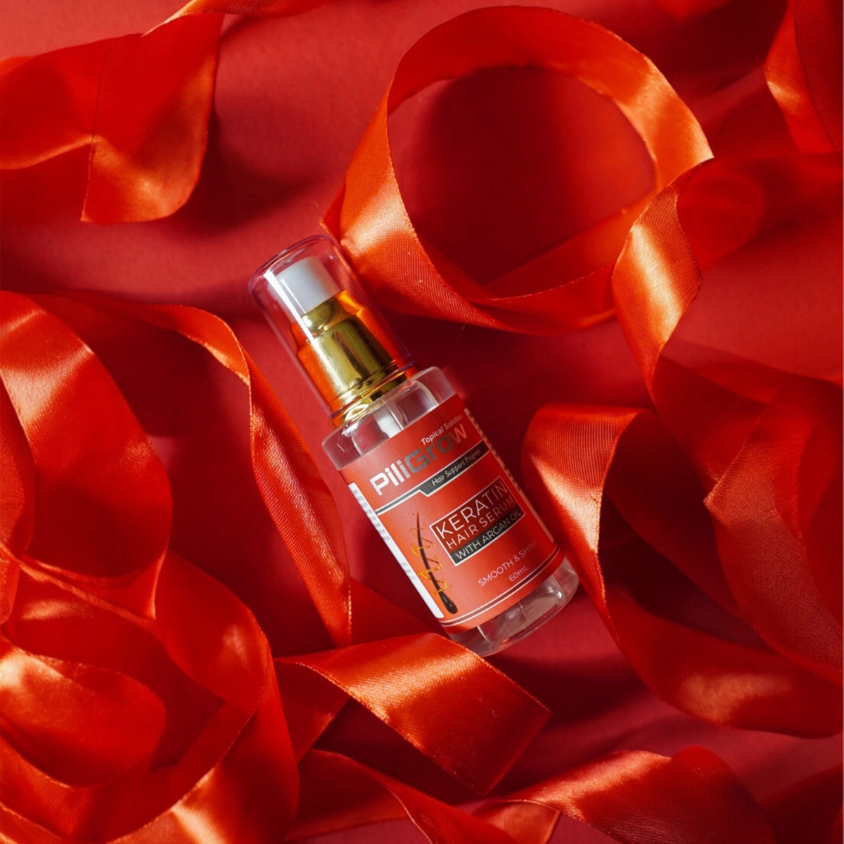 Piligrow keratin hair serum with red background