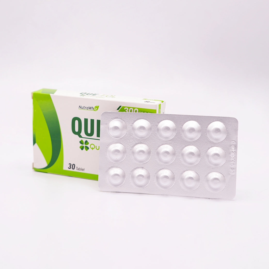 Que-Fol Tablets, a Nutra Whiz 4th generation folic acid supplement for daily use, shown with its box and blister pack.