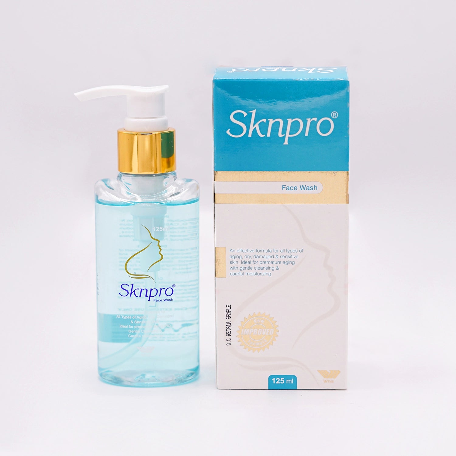 Sknpro Face Wash, 125ml clear bottle with a gold pump dispenser and a blue and white label featuring a stylized silhouette of a face.