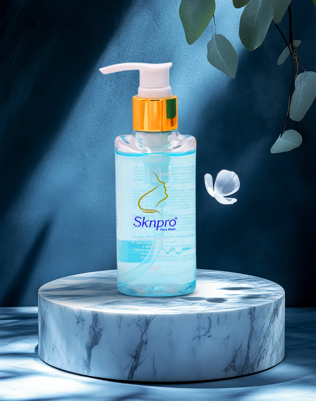 Skrnpro Face Wash, a clear bottle with a white and gold pump dispenser, containing a light blue liquid with a pearlescent finish