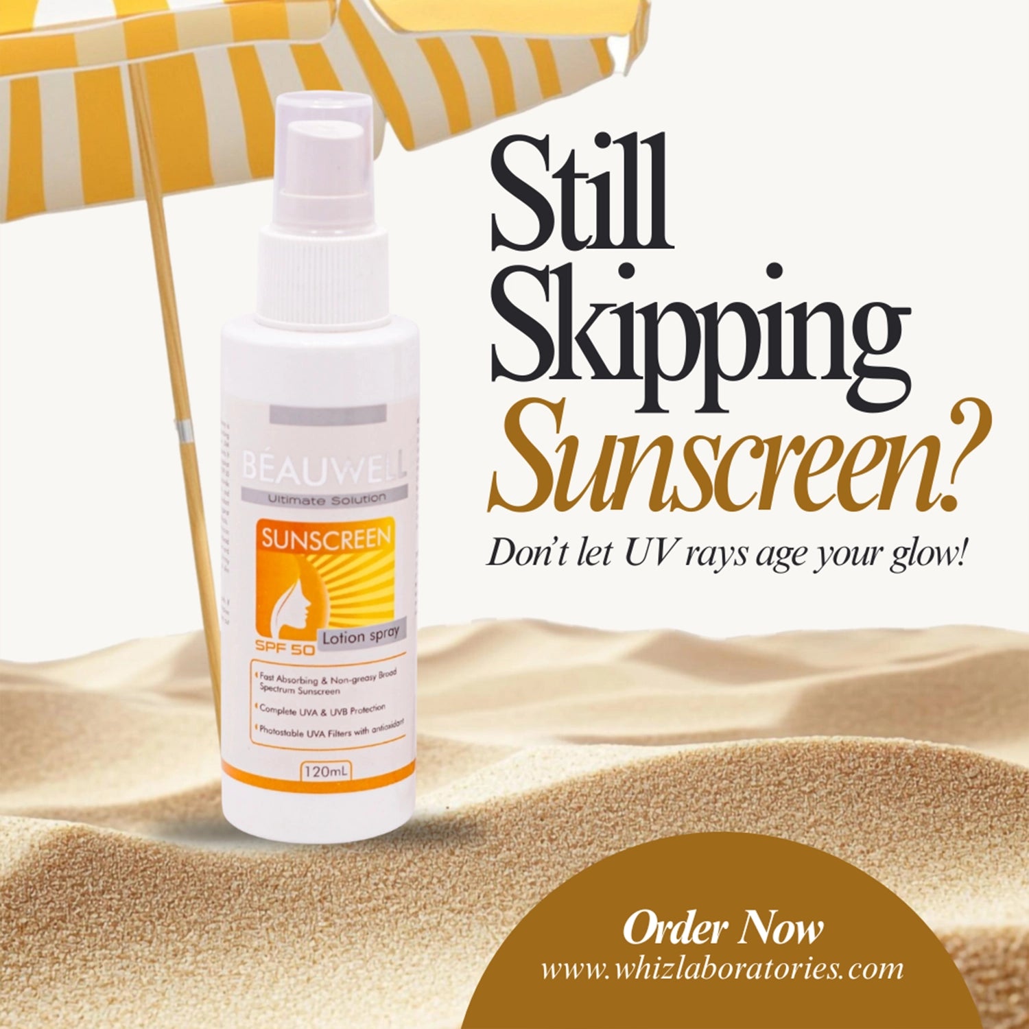 Beauwell Sunscreen Lotion Spray. A white bottle of the spray is placed on a sandy beach next to a yellow and white striped beach umbrella.