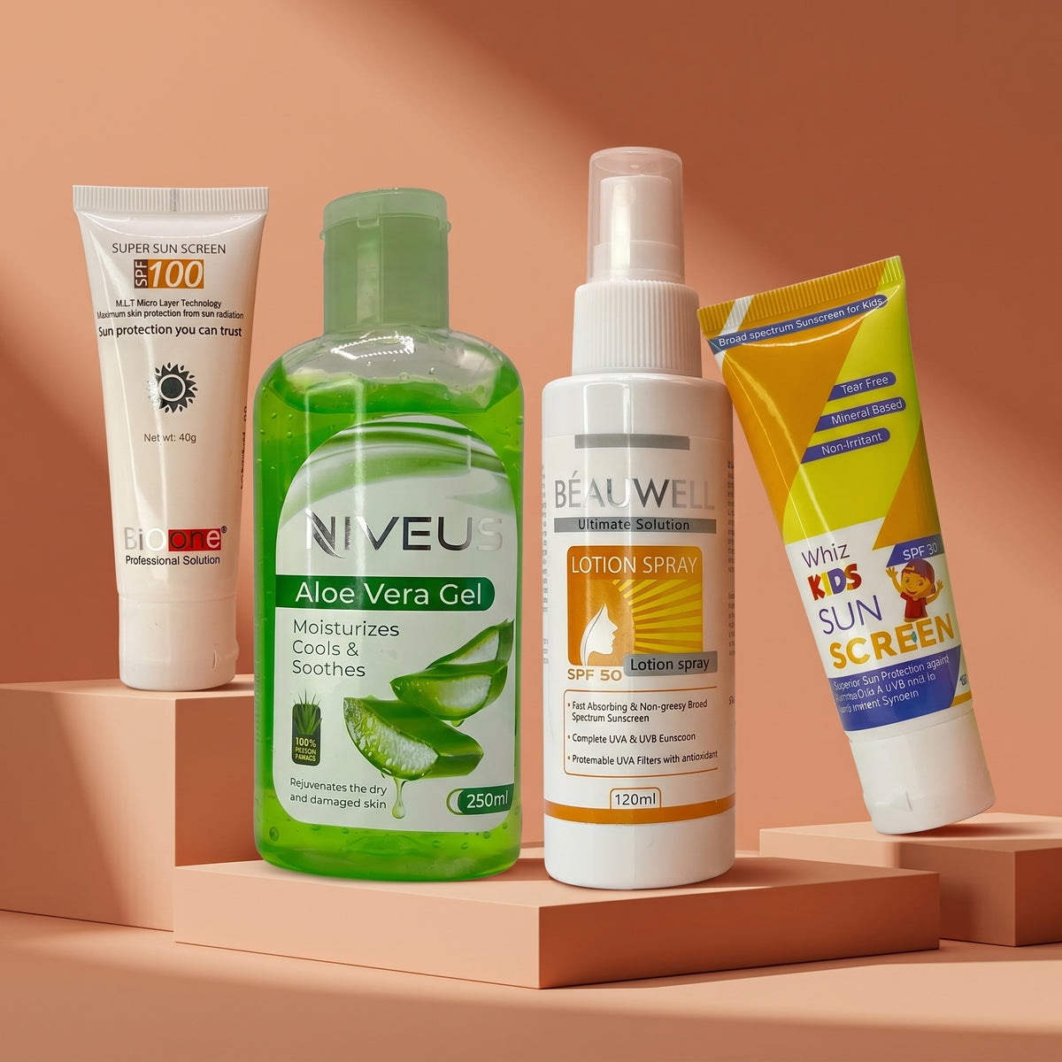 Whiz Beach Ready Kit featuring Bio One SPF 100 Sun Screen, Niveus Aloe Vera Gel, Beauwell SPF 50 Lotion Spray, and Whiz Kids Sunscreen on a warm-toned background.