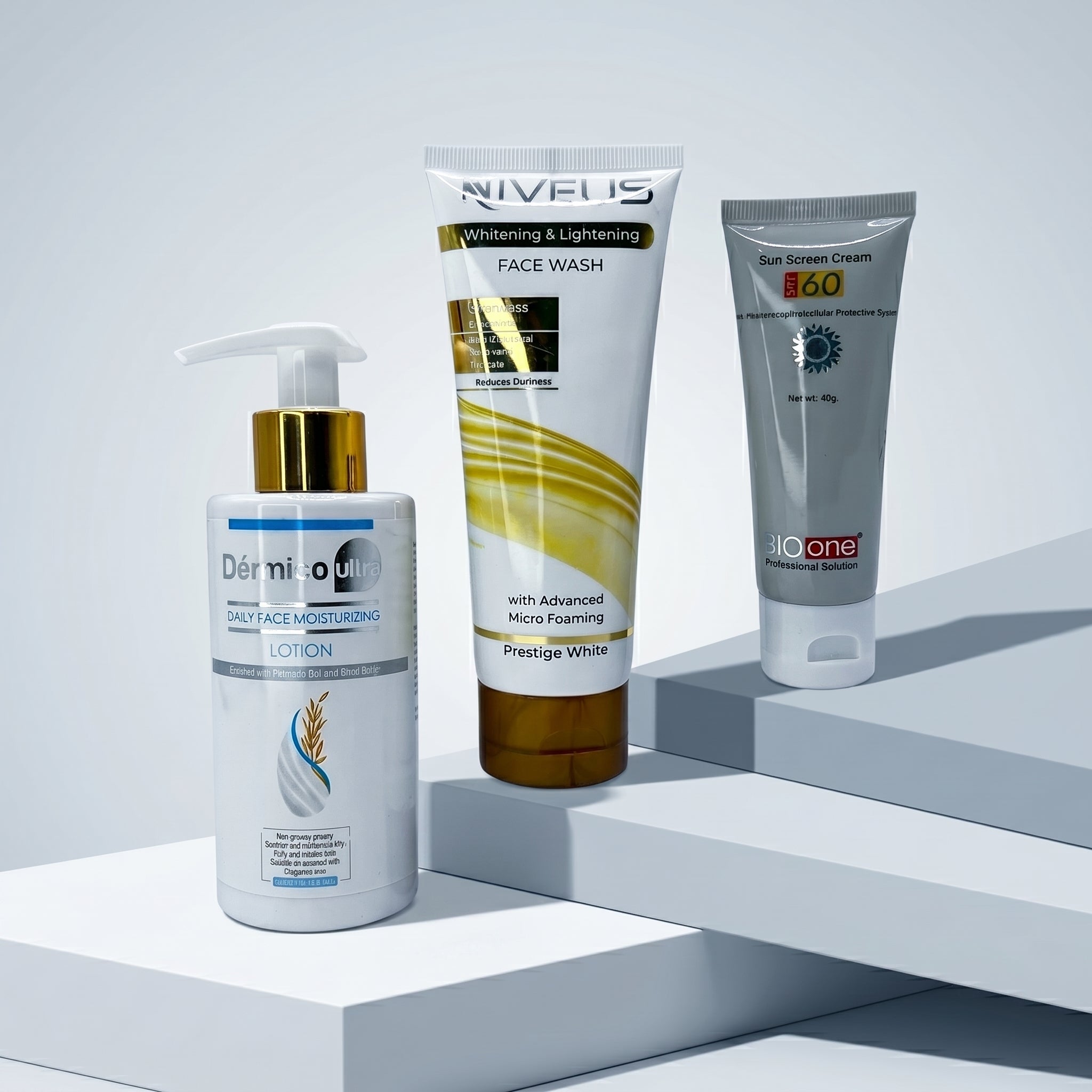Whiz Economical Kit featuring Dermive Urea Daily Face Moisturizing Lotion, Niveus Whitening & Lightening Face Wash, and Bio One SPF 60 Sun Screen Cream on white pedestal blocks.