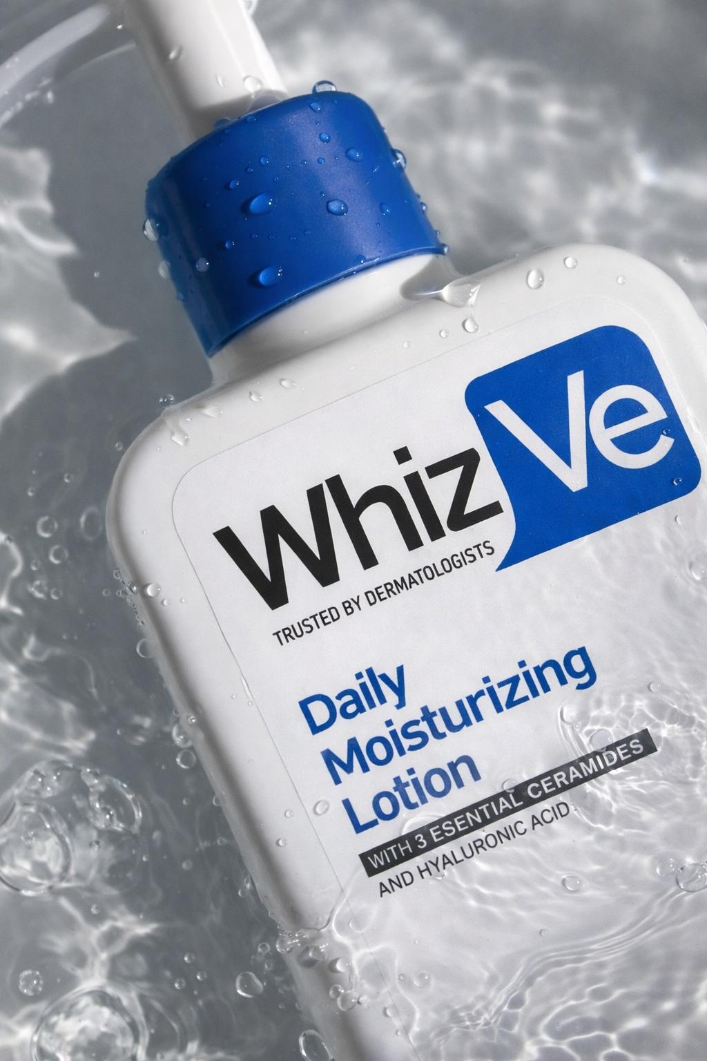 Whiz Ve Daily Moisturizing Lotion with ceramides and hyaluronic acid, shown with a refreshing water splash effect.